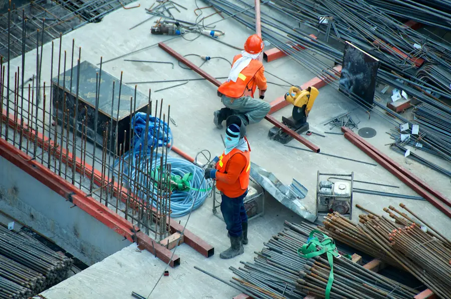 Crew placing rebar on a concrete deck