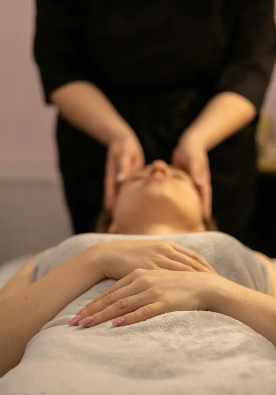 Esthetician giving a relaxing facial